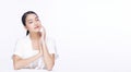 Beauty, cosmetics, healthy, treatment, skincare and spa concept. Asian young woman touching own face with clear fresh skin. Royalty Free Stock Photo