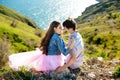 Beauty Couple relaxing on wheat field together. Teenage girlfriend and boyfriend having fun outdoors, kissing and Royalty Free Stock Photo