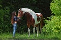 Beauty cowgirl with appaloosa horse