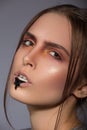 Beauty creative makeup with black bread on lips