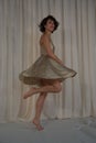 Beauty dance with fluttering skirt. Golden play.