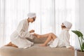 Mom And Daughter In Bathrobes And Stylish Sunglasses Doing Pedicure At Home Royalty Free Stock Photo