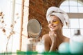 Beauty Day. Woman doing her daily skincare routine at home Royalty Free Stock Photo