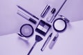 Beauty, decorative cosmetics. Ultraviolet Makeup brushes set and color eyeshadow palette , flat lay, top view, Minimalistic style.