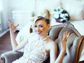 Beauty emotional blond bride in luxury interior