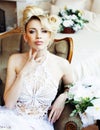 Beauty emotional blond bride in luxury interior