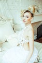 Beauty emotional blond bride in luxury interior