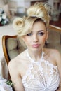 Beauty emotional blond bride in luxury interior