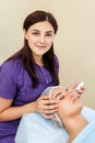 Beauty eye contour wrinkle cream or anti-aging skin care cream. young woman`s face with points of cream under the eyes Royalty Free Stock Photo