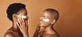 Beauty, eye pads and face of black women in studio with glowing, natural and facial routine. Smile, skincare and