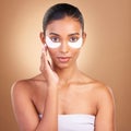 Beauty, eye patch and portrait of Indian woman in studio for facial, spa treatment and glow. Self care, cosmetics and Royalty Free Stock Photo