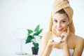 Beauty Face Care. Woman Applying Cream On Skin. Royalty Free Stock Photo