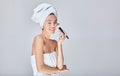 Happy young beautiful girl does makeup Royalty Free Stock Photo