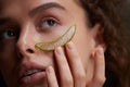 Beauty Face. Woman Holding Slices Of Fresh Juicy Aloe Vera Leaf At Her Face Royalty Free Stock Photo