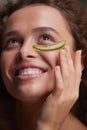 Beauty Face. Woman Holding Slices Of Fresh Juicy Aloe Vera Leaf At Her Face Royalty Free Stock Photo