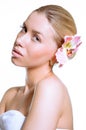 Beauty face of the young beautiful woman with flower Royalty Free Stock Photo