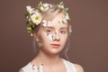 Beauty fantasy model spring woman with white flowers and butterfly on her head and skin. Royalty Free Stock Photo