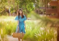 Farm lady Woman carrying a basket walking in agricultural field for carefree and healthy nature lifestyle concept