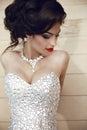 Beauty fashion brunette model portrait. Elegant lady in luxurious glamour dress with oriental gemstones and expensive jewelry. Ma Royalty Free Stock Photo
