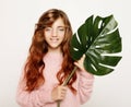 Beauty and fashion concept: Little curly girl child holding flower Royalty Free Stock Photo