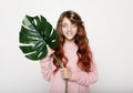 Beauty and fashion concept: Little curly girl child holding flower Royalty Free Stock Photo