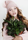 Beauty and fashion concept: Little girl wearing pink outfit and holding flower Royalty Free Stock Photo