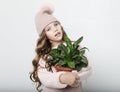 Little girl wearing pink outfit and holding flower Royalty Free Stock Photo