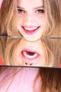 Beauty and fashion. Hairdresser salon and makeup concept. Girl look at mirror as multifaceted personality. Healthy teeth