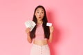 Beauty, fashion and lifestyle concept. Close-up of impressed pretty asian girl amazed with big discount with credit card Royalty Free Stock Photo