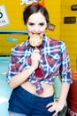 Beauty fashion model girl Eating colourful lollipop. Lollypop. Royalty Free Stock Photo