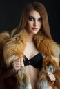 Beauty Fashion Model Girl in fox Fur Coat Royalty Free Stock Photo