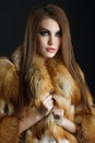 Beauty Fashion Model Girl in fox Fur Coat Royalty Free Stock Photo