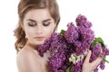 Beauty fashion model Girl with Lilac Flowers Hairstyle. Royalty Free Stock Photo