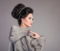 Beauty Fashion Model Girl in Mink Fur Coat. Beautiful Woman Luxury Winter Portrait. Beauty makeup and elegant Hairstyle. Royalty Free Stock Photo