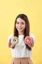 Beauty fashion model girl taking sweets and colorful donuts Royalty Free Stock Photo