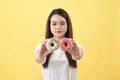 Beauty fashion model girl taking sweets and colorful donuts Royalty Free Stock Photo