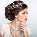 Beauty Fashion Model Girl with wedding elegant hairstyle. Beautiful bride woman with precious jewels, manicured nails. Makeup.