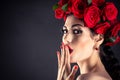 Beauty fashion model with red roses Royalty Free Stock Photo