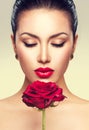 Beauty fashion model woman with red rose flower Royalty Free Stock Photo