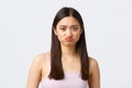 Beauty, fashion and people emotions concept. Close-up portrait of pouting upset cute asian girl grimacing, complaining