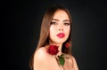 Beauty fashion portrait. Beautiful woman with makeup and rose flowers on black  background. Inspiration of Royalty Free Stock Photo