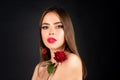 Beauty fashion portrait. Beautiful woman with makeup and rose flowers on black isolated background. Inspiration of Royalty Free Stock Photo