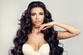 Beauty Fashion Portrait of Glamorous Brunette Woman. Healthy Skin, Wavy Hairstyle and Hands