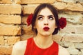 Beauty fashion portrait. woman with red lips and fresh roses in hair Royalty Free Stock Photo