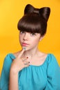 Beauty fashion teen girl with bow hairstyle and colourful manicu