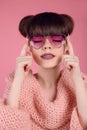 Beauty Fashion teen girl model in heart sunglasses. Portrait of