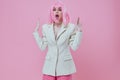 Beauty Fashion woman attractive look white blazer pink wig pink background unaltered Royalty Free Stock Photo