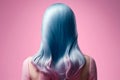 Beauty fashion woman with colorful blue and pink dyed hair, view from back. Hair salon, care and beauty hair products, trendy