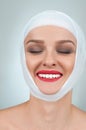 Beauty and Fashion. Woman after plastic surgery with bandaged face. Royalty Free Stock Photo