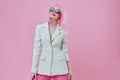 Beauty Fashion woman in White blazer pink hair Glamor Cosmetics color background unaltered Royalty Free Stock Photo